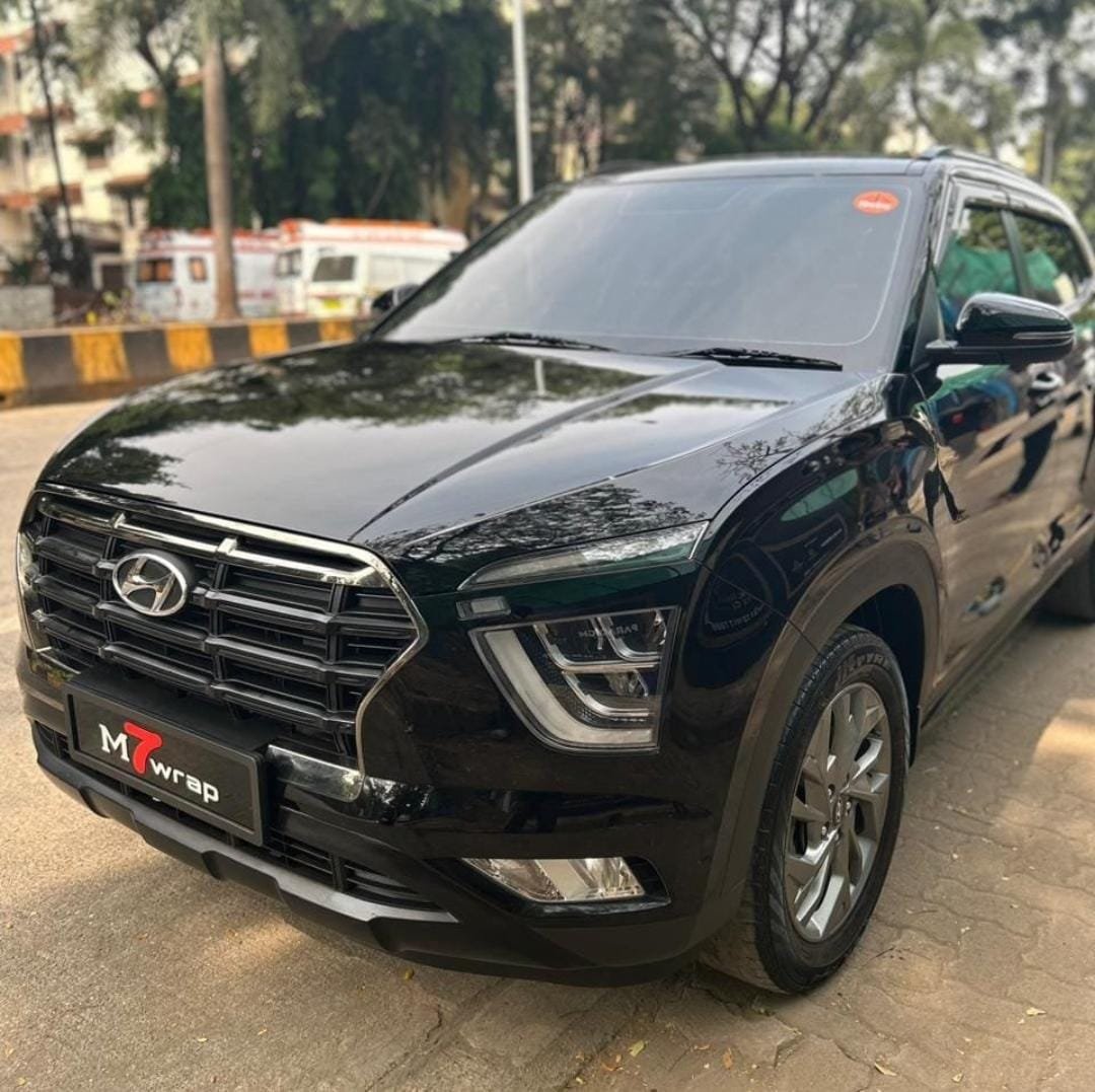 Black SUV fitted with a custom M7WRAP number plate